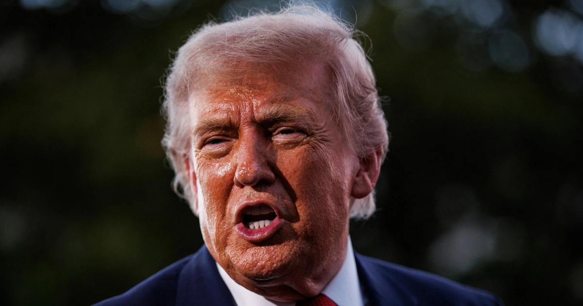 Donald Trump reacts to his hair during RNC speech