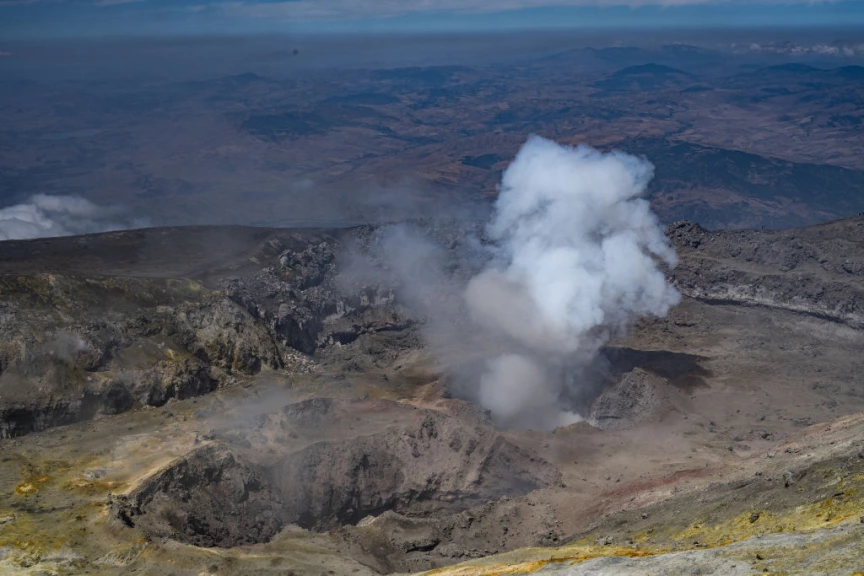 Volcano that puffed out incredible 'vortex rings' now covered in snow ...