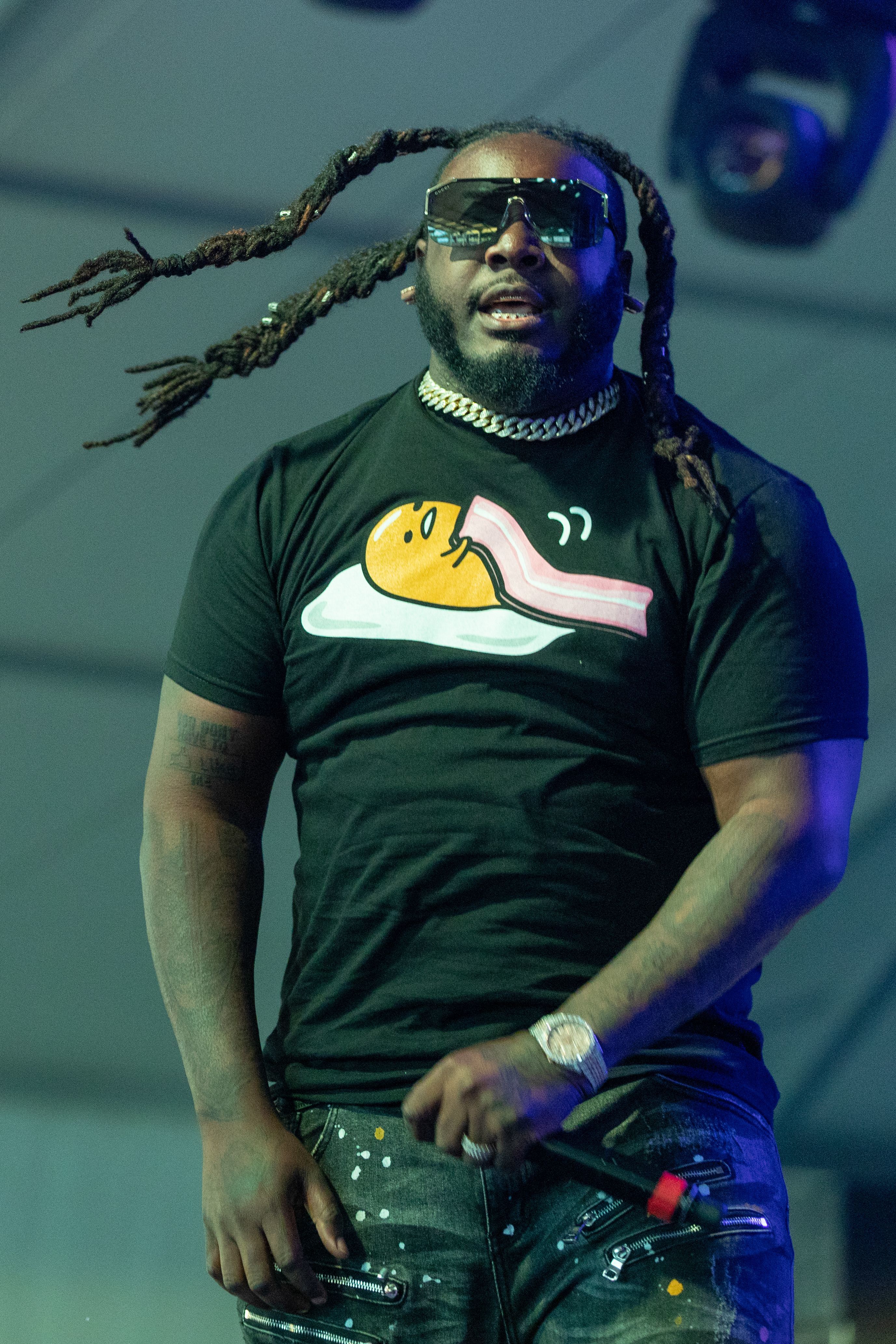 Rapper T-Pain and bodyguard held at Atlanta airport for gun in carry-on