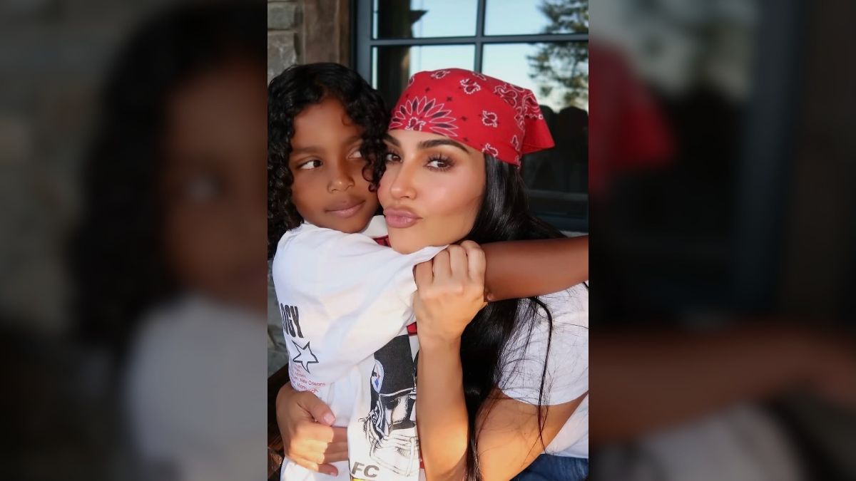 Kim Kardashian poses with beau Lewis Hamilton and children